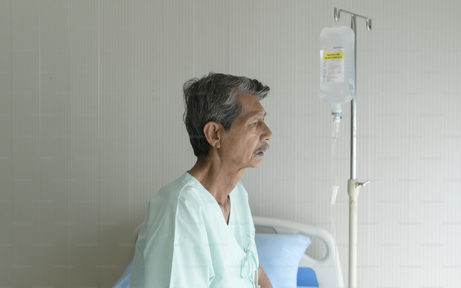 Portrait of senior patient lying on bed in hospital, healthcare and medical concept
